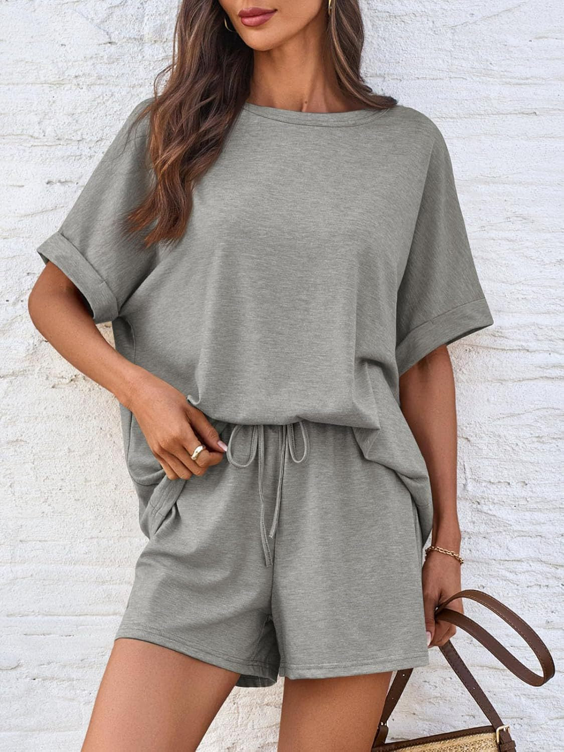 Gray relaxed fit tee and shorts loungewear set with cuffed sleeves and drawstring waist.