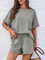 Gray relaxed fit tee and shorts loungewear set with cuffed sleeves and drawstring waist.