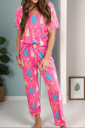 Hot pink lounge set with Christmas tree print, V-neck top and drawstring pants.