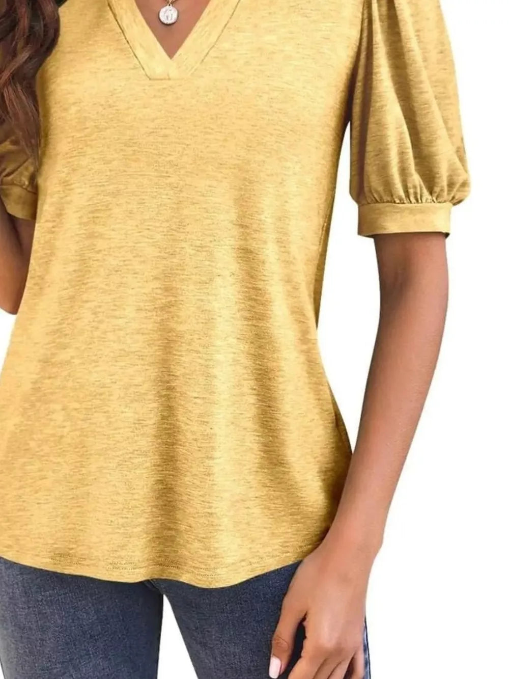 Yellow puff sleeve t-shirt with notched V-neck and textured fabric.