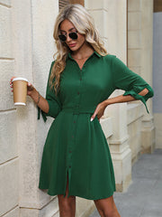 Belted tie-sleeve shirt dress in mid green with button front and A-line skirt.