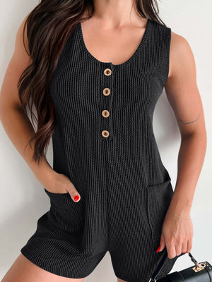 Black ribbed button-down romper with pockets and gold buttons
