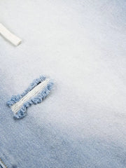 Men's distressed wide-leg capri jeans in light blue denim with frayed details.