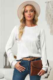 Textured wave crewneck pullover in white with long sleeves and a relaxed fit.