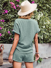 Textured cotton drawstring shorts set in moss green with cuffed short sleeves and relaxed fit shorts.