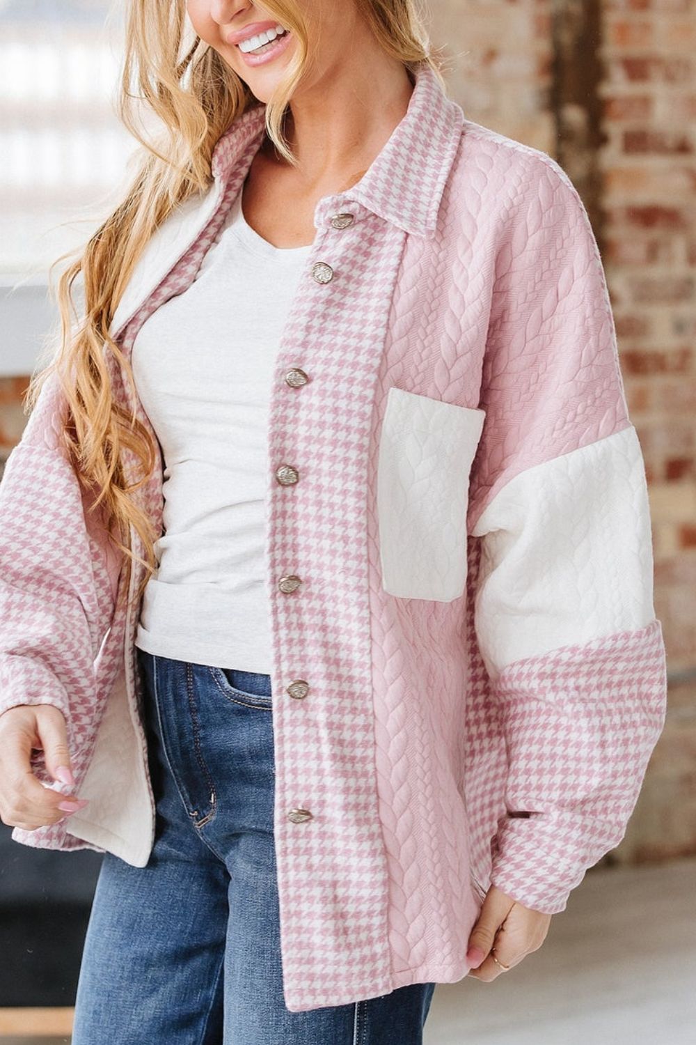 Panelled houndstooth quilted shacket in dusty pink with cable knit details and a chest pocket.