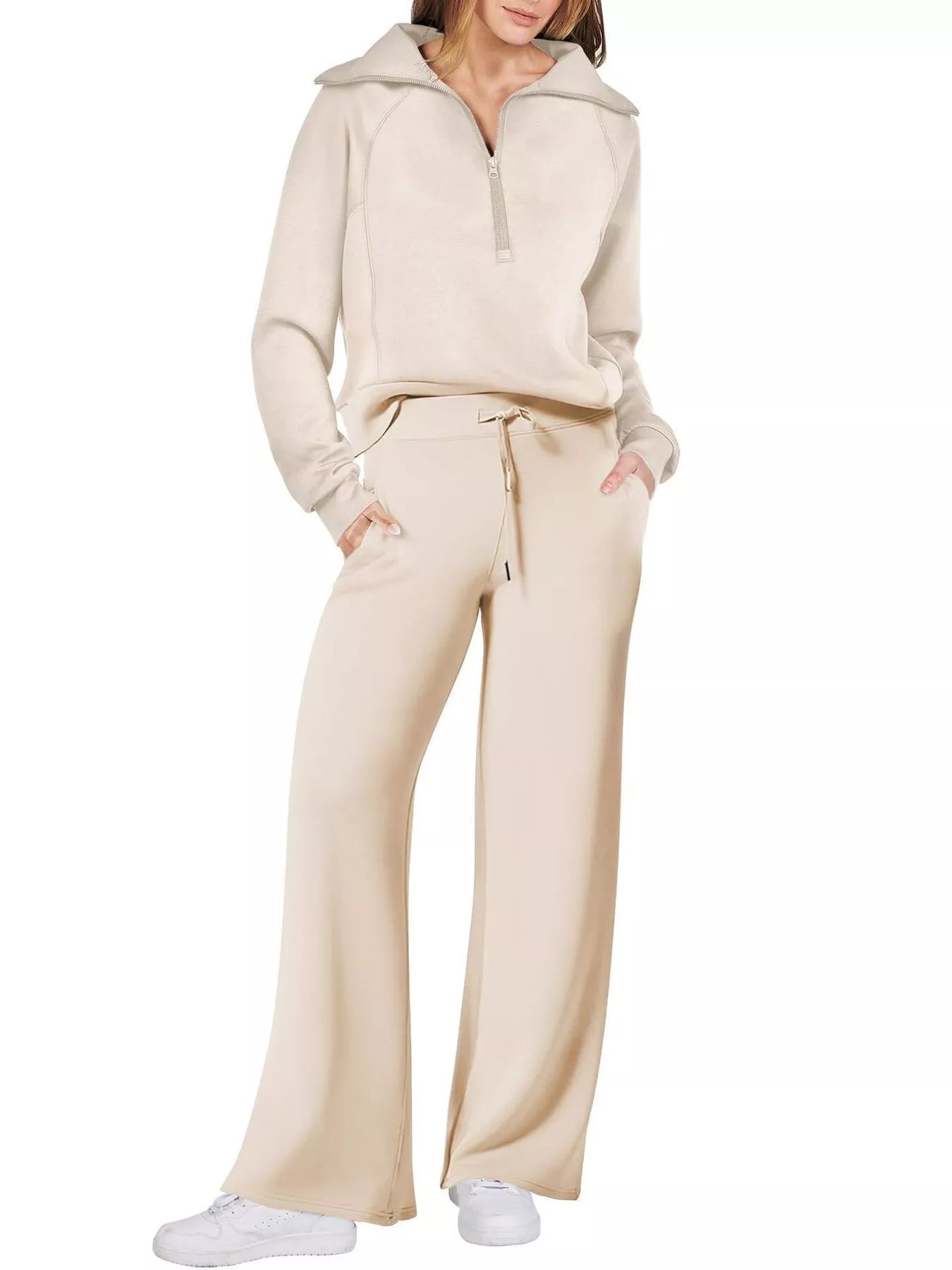 Beige half zip lounge set with wide leg pants and a collared sweatshirt.