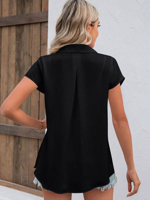 Black textured collared shirt with short sleeves and a back pleat detail.