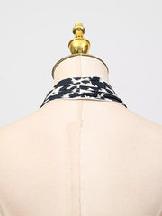 Black and white leopard print halter neck dress detail