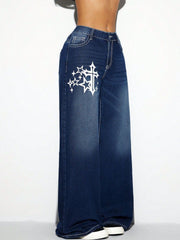 Dark wash cotton palazzo jeans with white cross and star graphic detail.