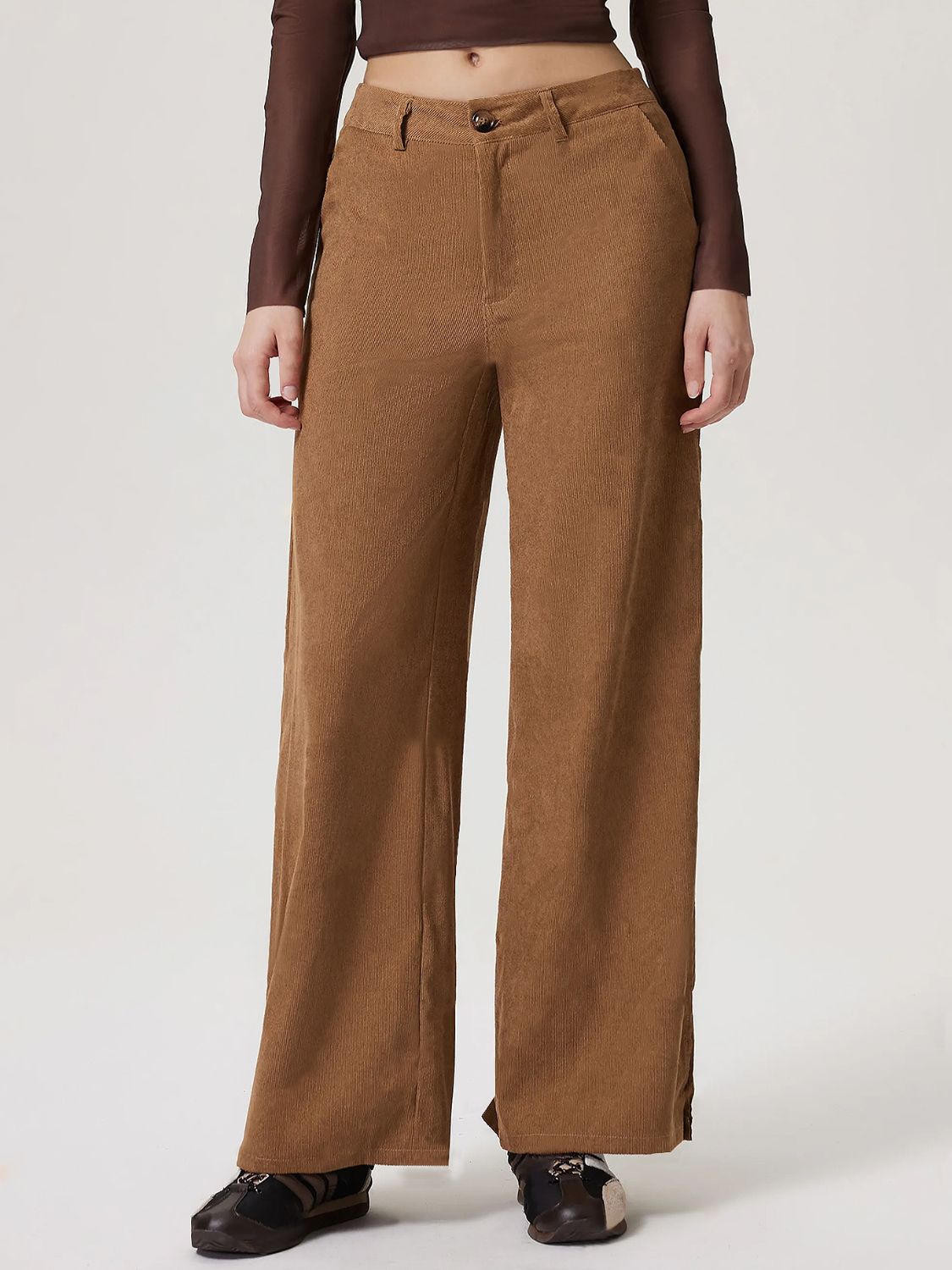 Corduroy wide-leg trousers in camel with a buttoned front.
