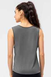 Dark gray performance tank top with a rounded neckline and strappy back detail.