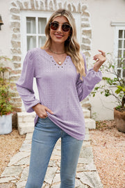 Lavender eyelet yoke blouse with blouson sleeves and v-neckline.