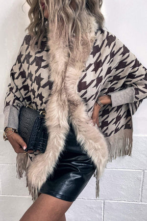 Houndstooth faux fur collar poncho in beige and brown with fringe detail.