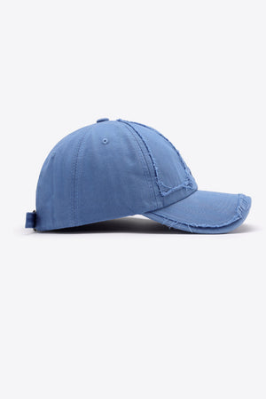 Cobalt blue denim baseball cap with raw edge details and adjustable strap