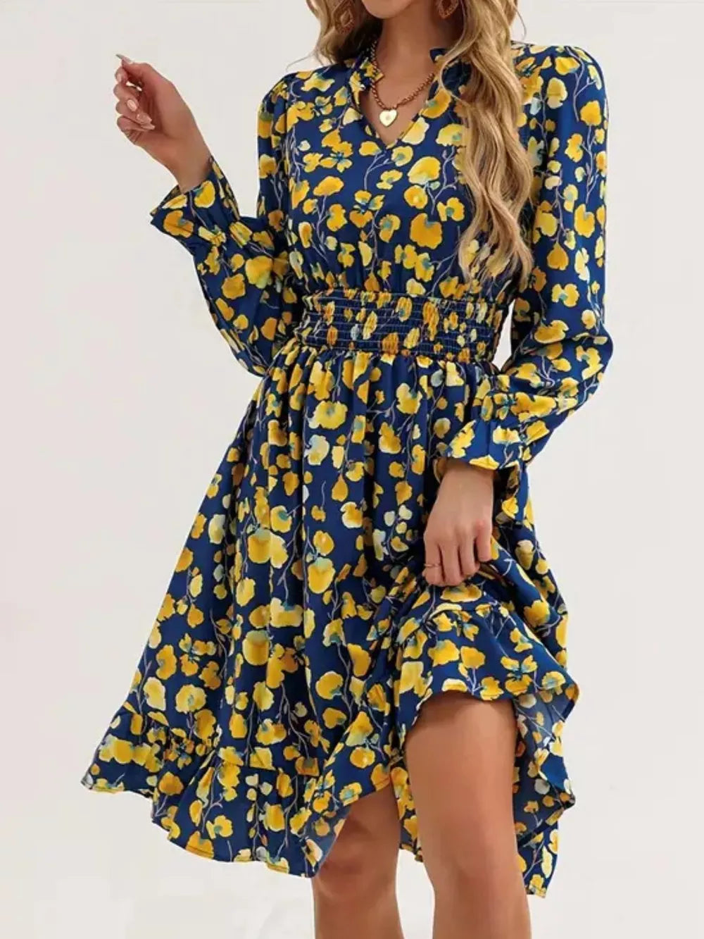 Blue floral smocked dress with v-neck and ruffled hem