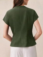 Green asymmetrical wrap shirt with cap sleeves and a buttoned detail.