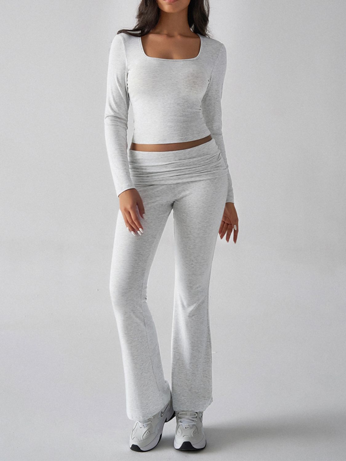 Light gray loungewear set with square neck long sleeve crop top and flared pants.