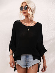 Black relaxed knit tunic top with boat neck, short sleeves, and a chest pocket.