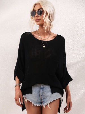 Black relaxed knit tunic top with boat neck, short sleeves, and a chest pocket.