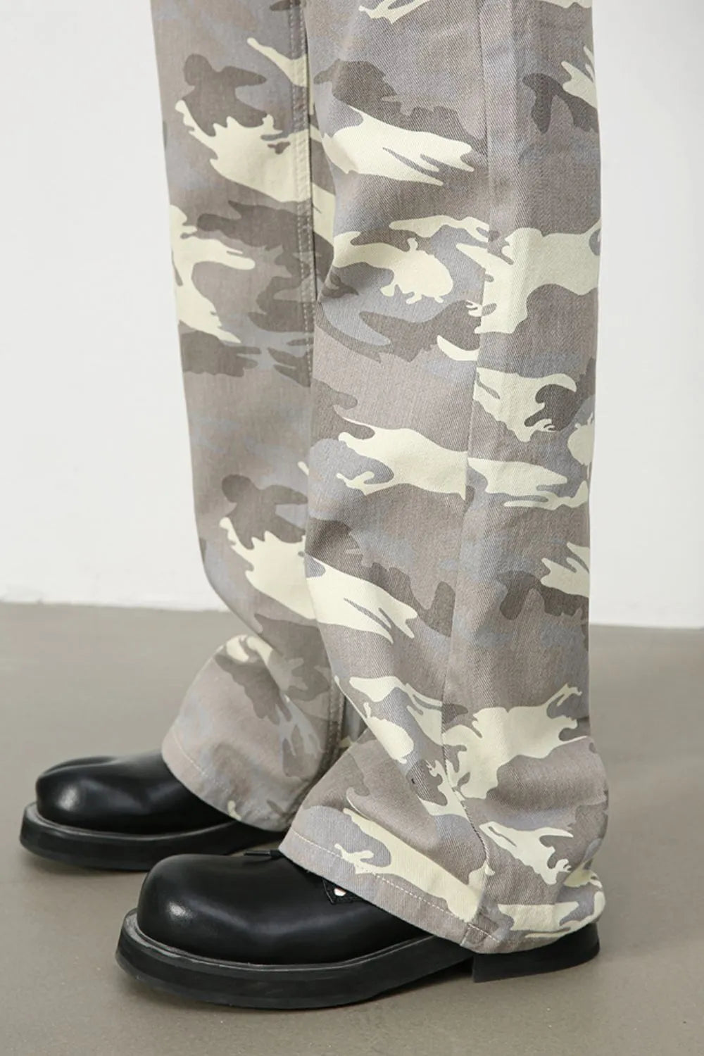 Camouflage flare denim trousers in gray with a relaxed fit.