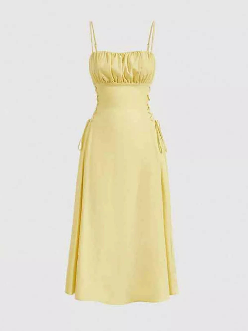 Light yellow cami dress with ruched bodice and crisscross lace-up sides.