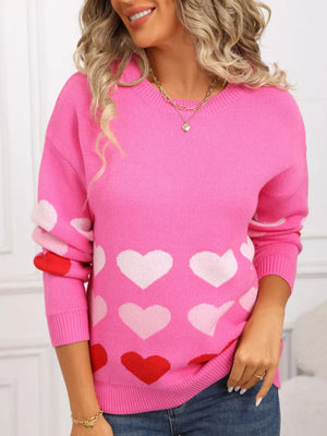 Rose red acrylic crew neck sweater with allover heart print and long sleeves.