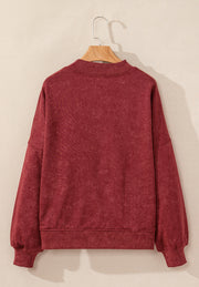 Acid wash mock neck sweatshirt in deep red with ribbed cuffs and hem.