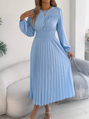 Light blue midi dress with long sleeves, ruffled neckline, and smocked waist.