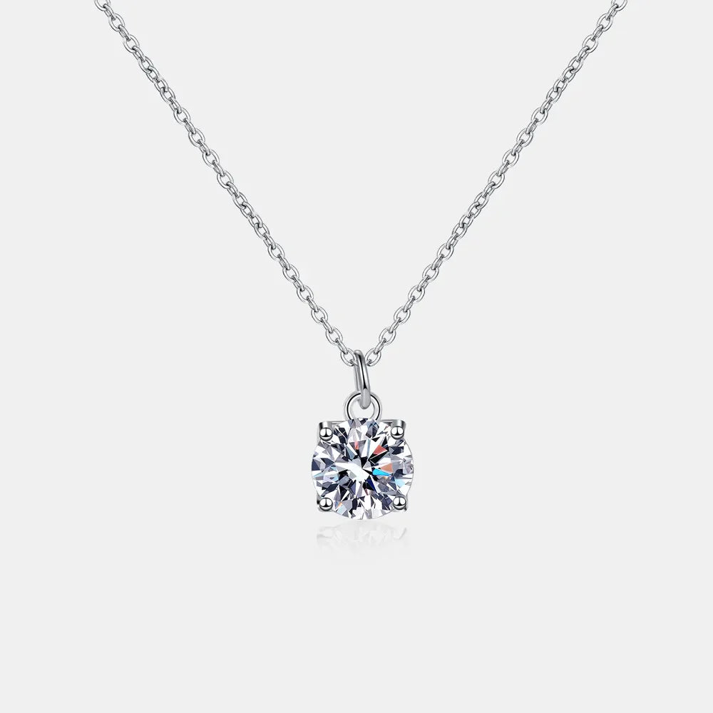 Solitaire moissanite pendant necklace in silver with a delicate chain.