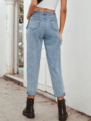 Light wash barrel leg jeans with pocket detail and cuffed hems.
