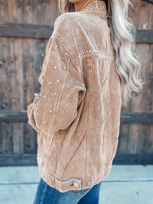 Tan corduroy jacket with pearl studs on collar, shoulders, and sleeves.