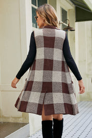 Longline plaid vest in Chestnut with collar and pockets, acrylic blend.