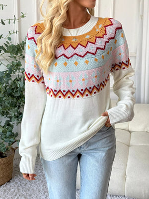 White geometric knit long-sleeve sweater with colorful yoke detail and crew neck.