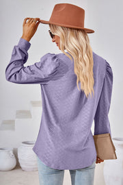 Lavender textured blouse with bishop sleeves and a diamond pattern.