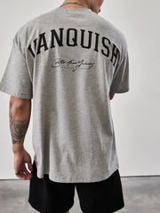 Gray oversized graphic tee with "Vanquish" back print and script text detail.