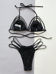 Black strappy bikini set with glitter detail and tie closures