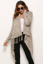 Oatmeal asymmetric fringe knit cardigan with button detail and waterfall hem.