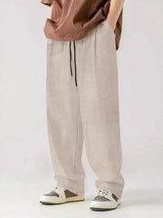 Textured corduroy relaxed fit trousers in white with drawstring waist.