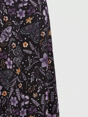Black midi skirt with a whimsical floral and butterfly print.
