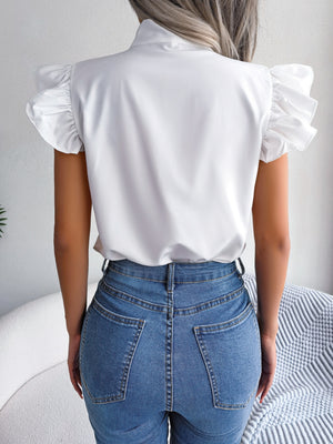 White ruffled sleeve blouse with pussybow detail, shown from the back.