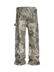 Carpenter jeans in Real Tree camo pattern with raw hem and mocha color.