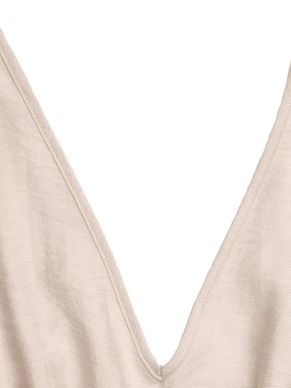 Beige V-neck romper with ruffled detail and wide legs