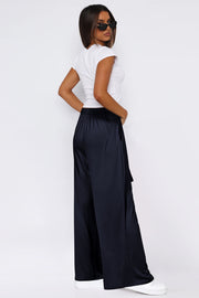 Dark Navy wide-leg flow pants with self-tie detail and pockets.