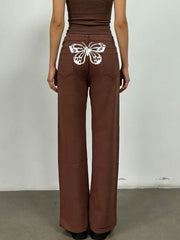 Brown maternity wide-leg jeans with white butterfly back detail