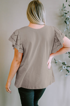 Mocha eyelet flutter sleeve tee with a round neckline.