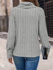 Gray ribbed cowl neck sweater with button cuffs and long sleeves.