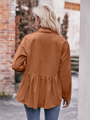 Corduroy peplum shirt jacket in ochre with buttoned cuffs and a ruffled hem.