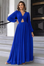 Royal blue maxi dress with long sleeves, deep V-neck, and twisted bodice cutout.