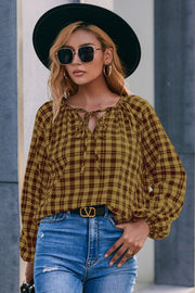 Gingham gathered neckline blouse in mustard with balloon sleeves and tie detail.